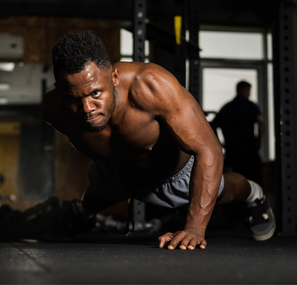 Man doing pushups in a gym