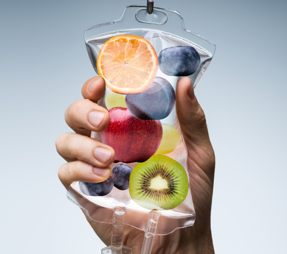 IV Infusion Therapy 1 Hand holding an IV bag filled with fruit