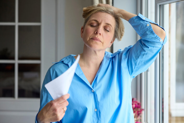 Middle-age woman having a hot flash, to represent Bioidentical Hormone Replacement Therapy