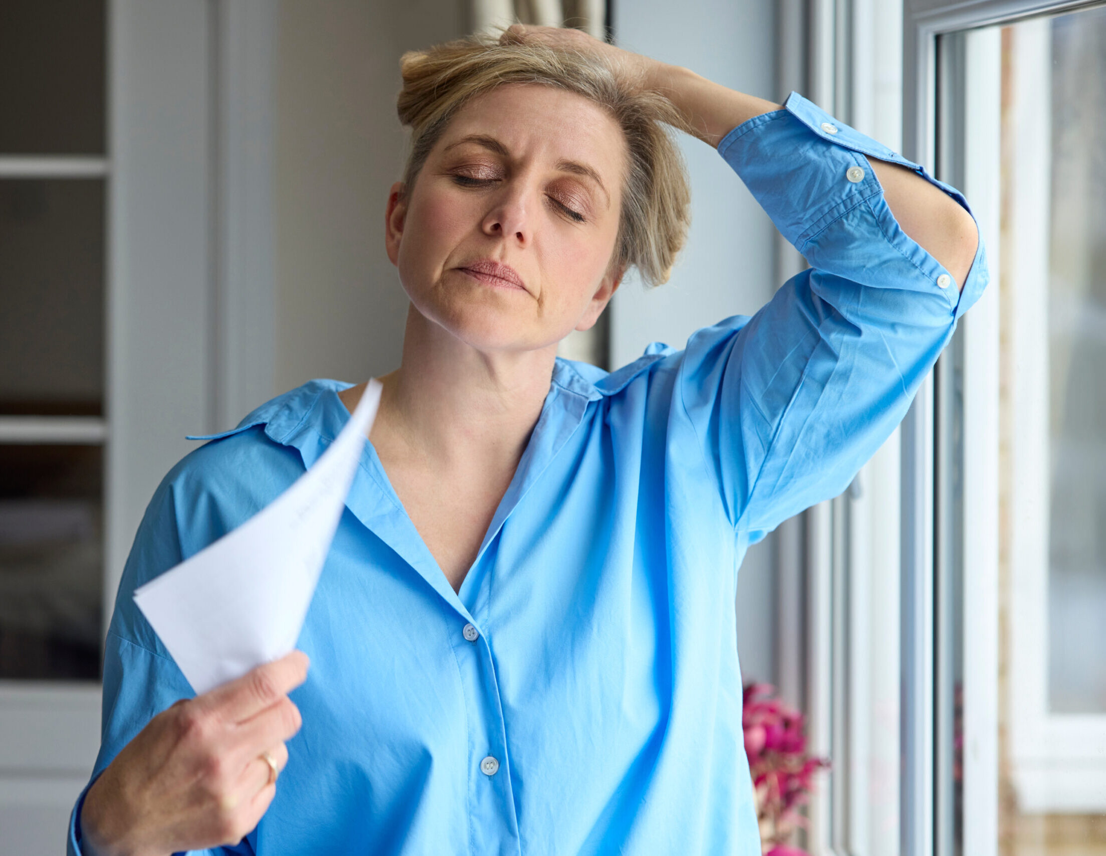 Functional Medicine in Minneapolis 5 Middle-age woman having a hot flash, to represent Bioidentical Hormone Replacement Therapy