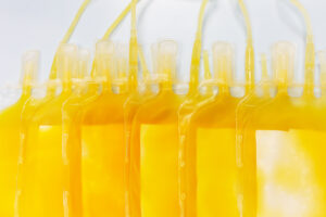 A row of plasma bags representing therapeutic plasma exchange, one of theLifespan Health treatments.