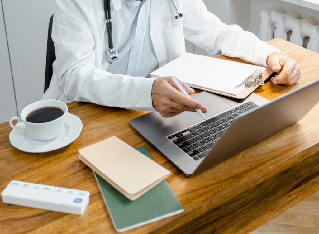 Lifespan Health Blog 1 A doctor working on a laptop, to signify writing a Lifespan Health Blog