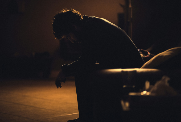 Chronic Illness man in a dark room